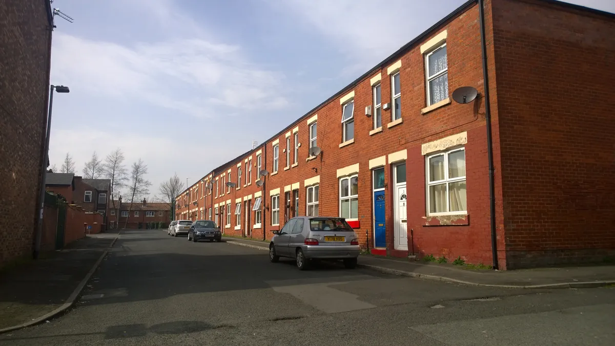 A long row of red-brick terraced houses on Smyrna Street in Weaste